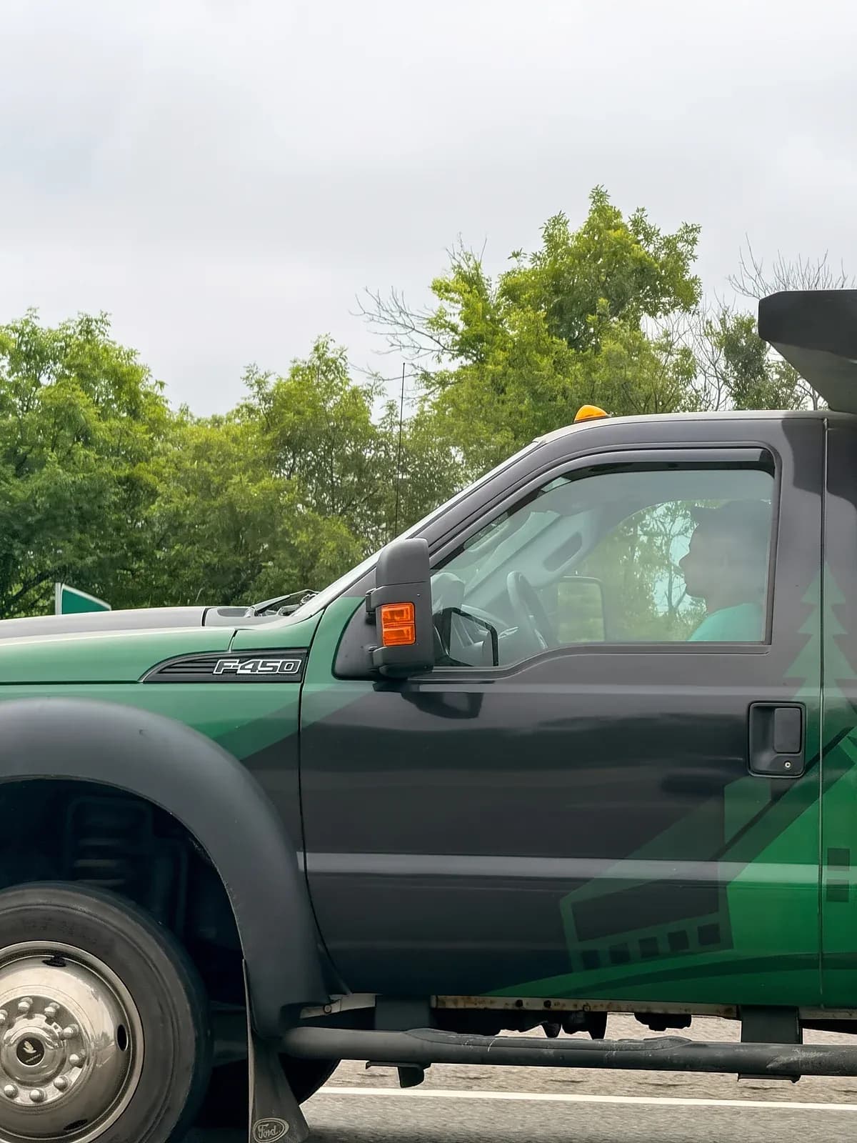 Machado Landscaping work truck with the company logo on the door